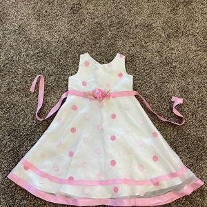 White with pink polka dots. Never worn no tags youngland beand